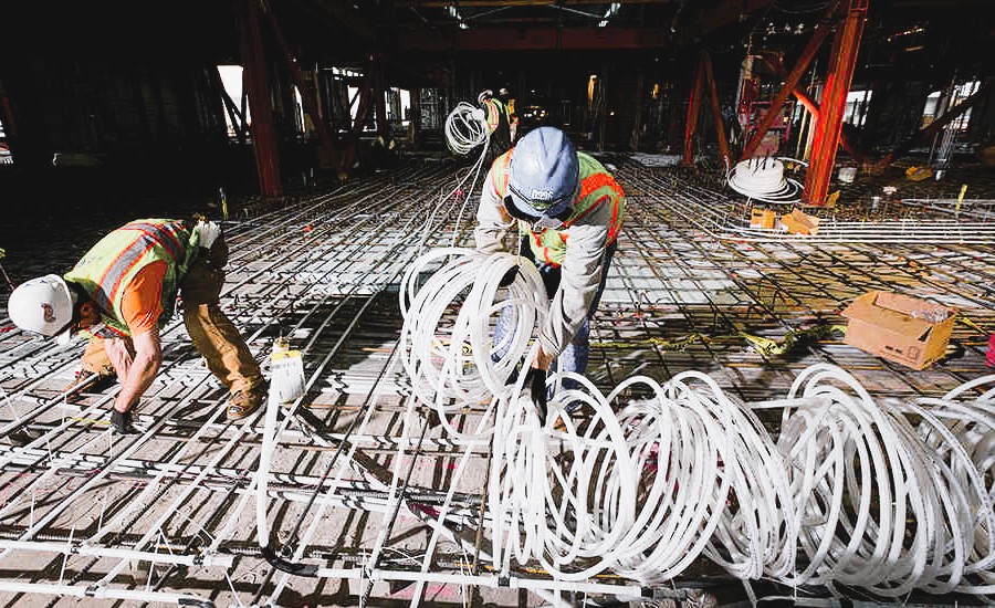 Workers make underfloor heating