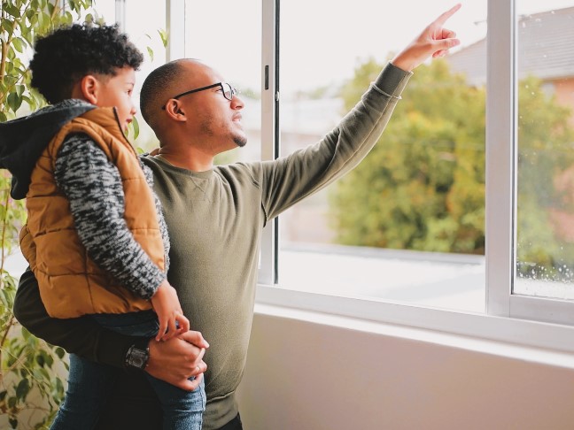 Father and son at the window